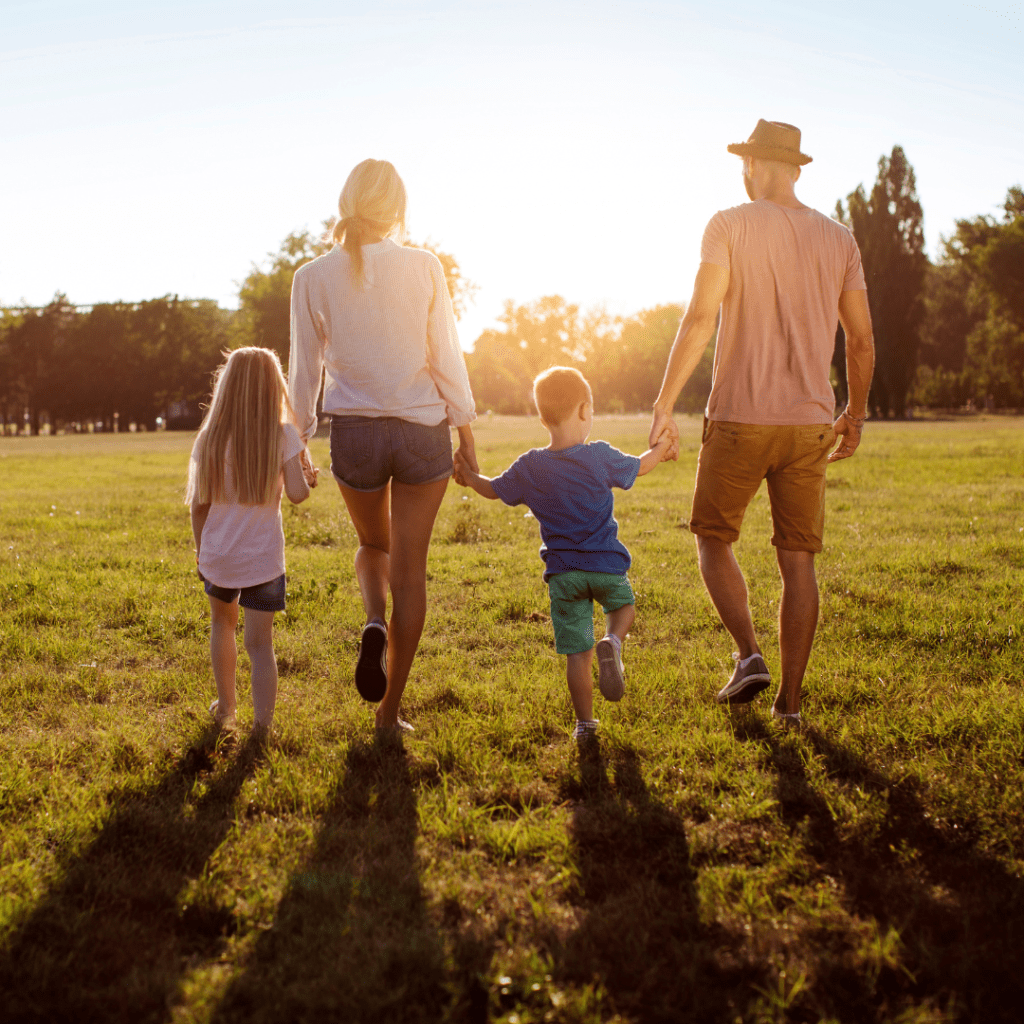 picture of family holding hands and walking away